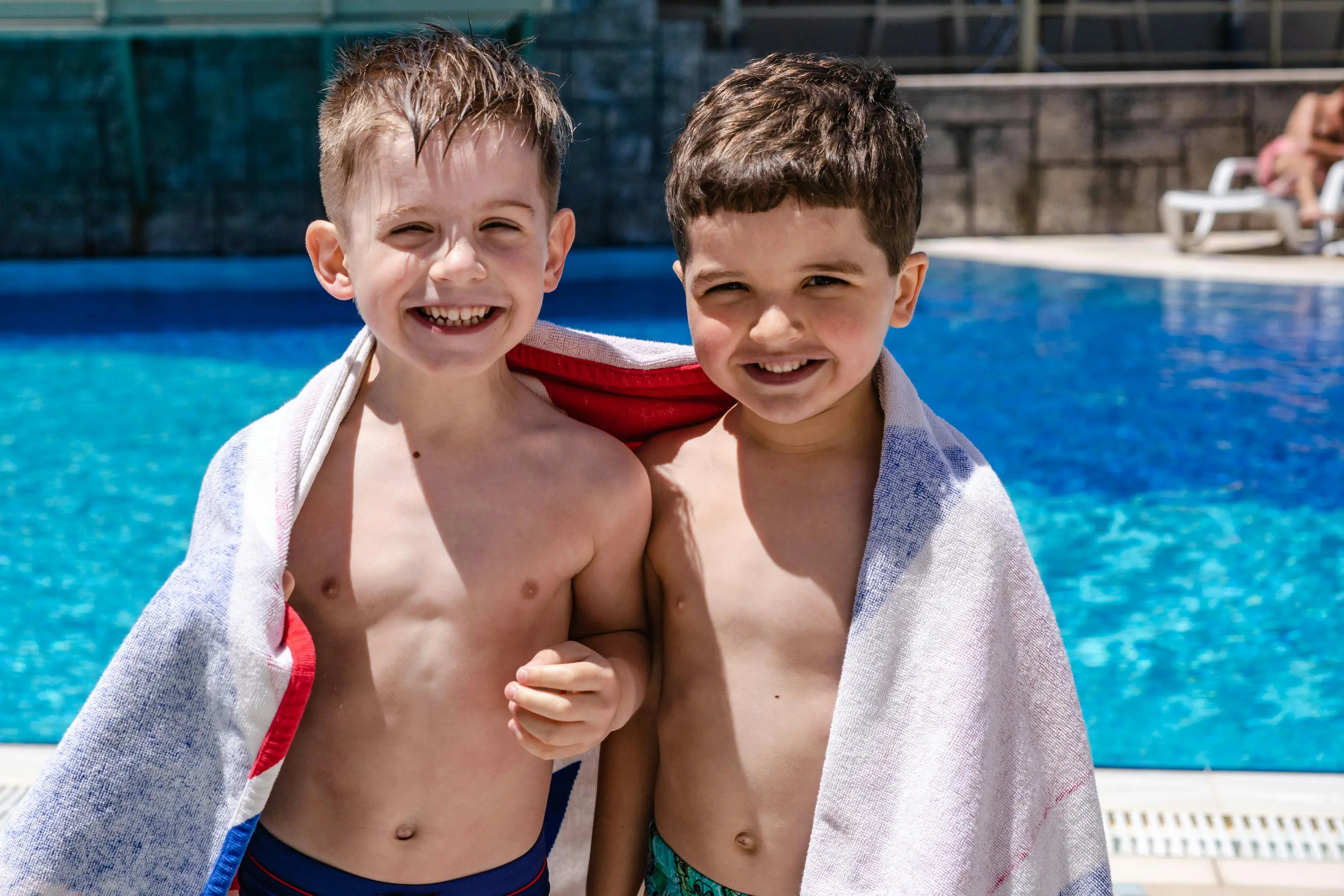 Children swimming together with coach